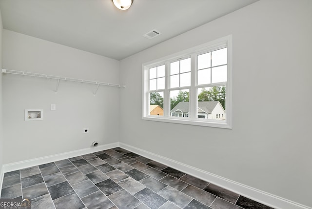 laundry room with washer hookup, visible vents, electric dryer hookup, laundry area, and baseboards