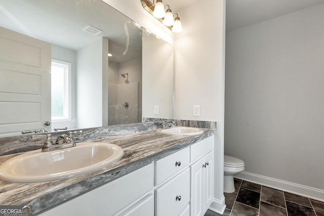 full bathroom with a shower, visible vents, a sink, and toilet