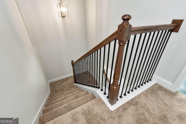 staircase with carpet and baseboards