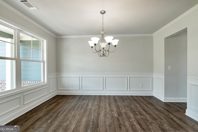 unfurnished dining area with crown molding, dark wood-style flooring, visible vents, and a notable chandelier