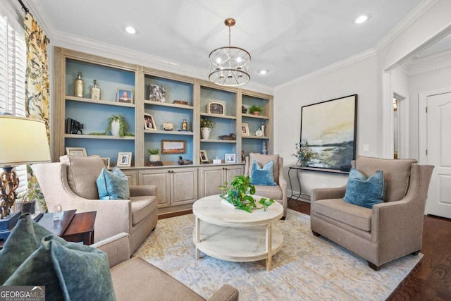 living area featuring a chandelier, ornamental molding, wood finished floors, and recessed lighting