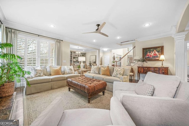 living room featuring recessed lighting, a ceiling fan, stairway, decorative columns, and crown molding