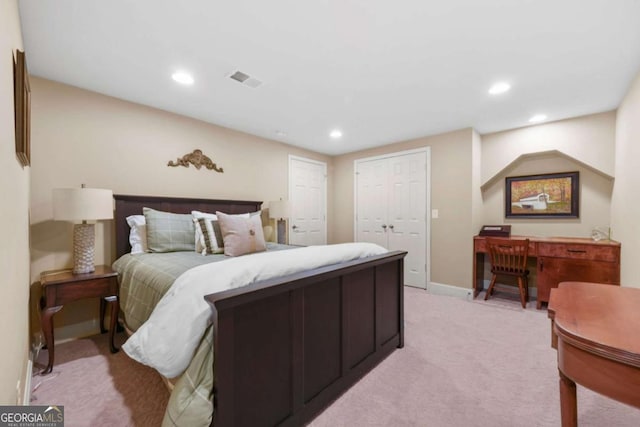 bedroom with baseboards, recessed lighting, visible vents, and light colored carpet