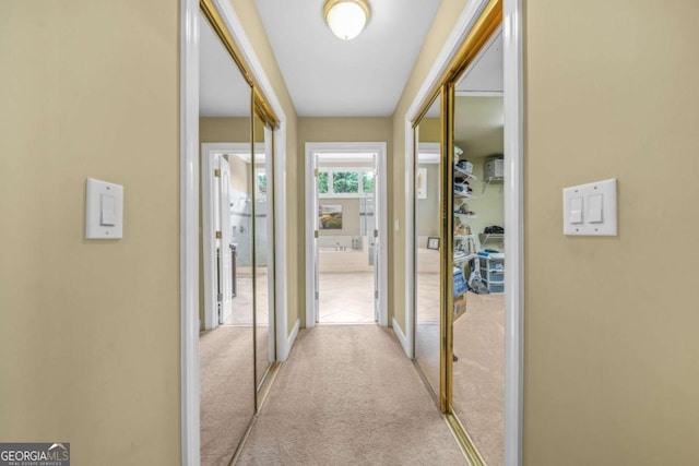 hallway with carpet floors