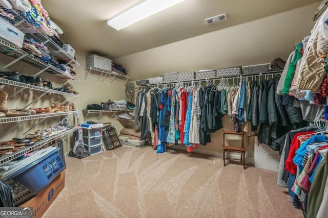 walk in closet with carpet and visible vents