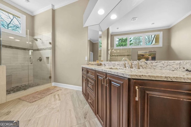 bathroom featuring a wealth of natural light, crown molding, and a stall shower