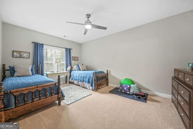 bedroom featuring a ceiling fan, baseboards, and carpet flooring