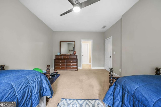 carpeted bedroom with ceiling fan, visible vents, and baseboards