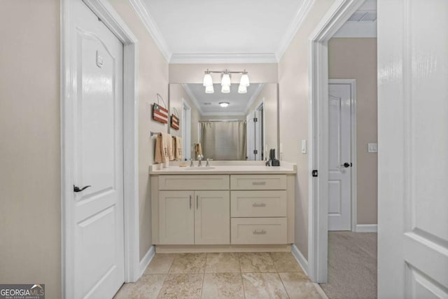 bathroom featuring crown molding, vanity, and baseboards