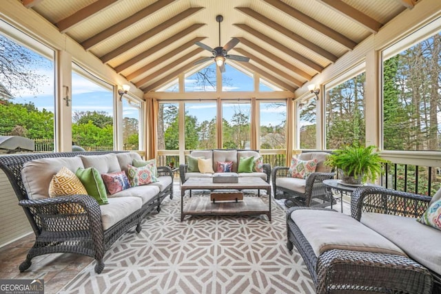 sunroom with vaulted ceiling with beams and ceiling fan