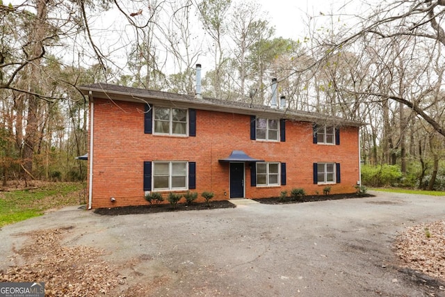 view of front facade featuring brick siding