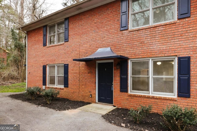 view of front of property featuring brick siding