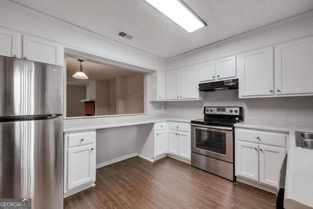 kitchen featuring stainless steel appliances, light countertops, visible vents, and under cabinet range hood