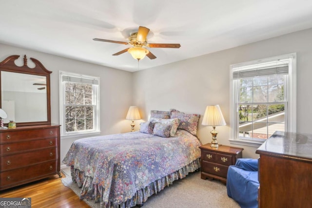 bedroom with ceiling fan and wood finished floors