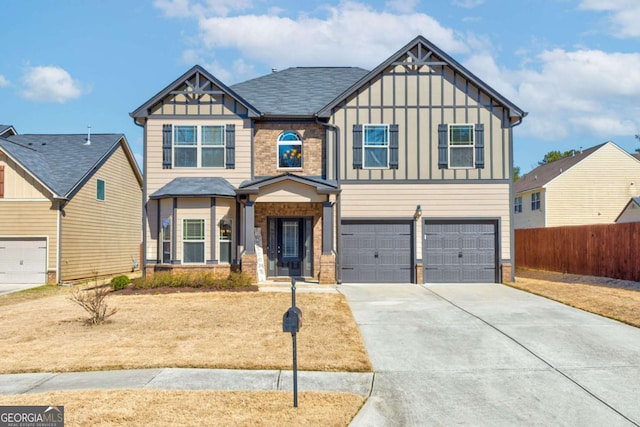 craftsman inspired home featuring brick siding, board and batten siding, fence, a garage, and driveway