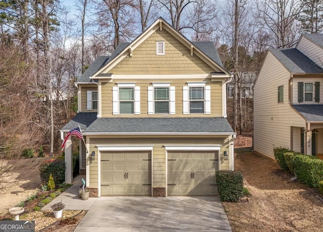 exterior space with an attached garage, driveway, and roof with shingles