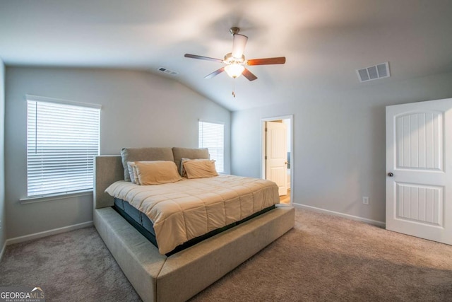 bedroom featuring carpet, visible vents, vaulted ceiling, and baseboards