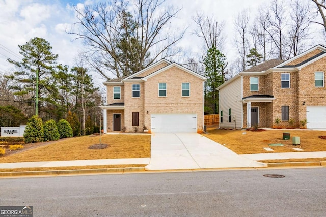 traditional home with driveway, brick siding, and an attached garage