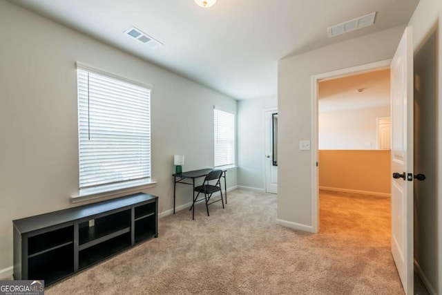 interior space with visible vents and baseboards