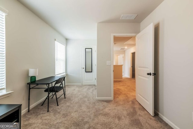 office area featuring carpet, visible vents, and baseboards