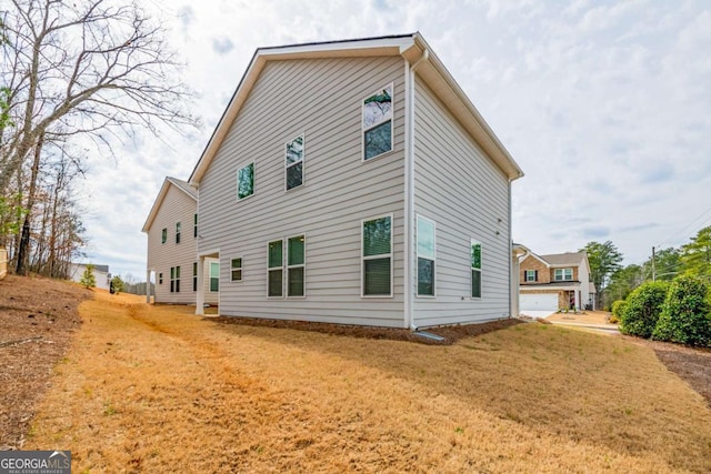 view of home's exterior featuring a yard