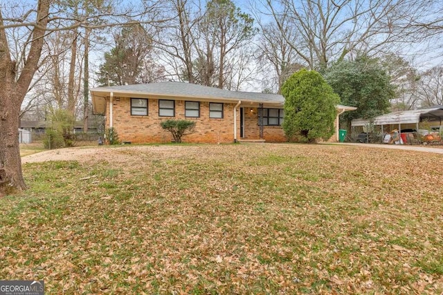 ranch-style house with crawl space, a shingled roof, a front yard, and brick siding