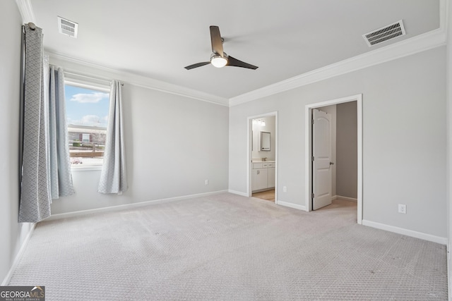 unfurnished bedroom with visible vents, baseboards, light colored carpet, and crown molding