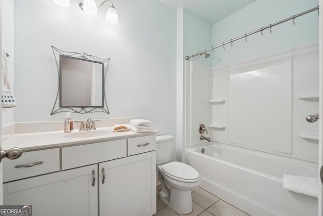 bathroom featuring tile patterned floors, toilet, tub / shower combination, and vanity