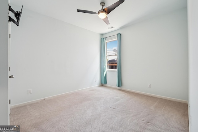 unfurnished room with visible vents, baseboards, carpet floors, and ceiling fan