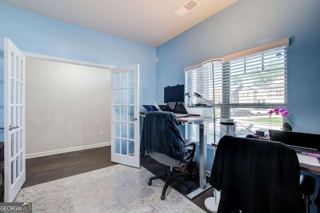 office space with baseboards, visible vents, wood finished floors, and french doors