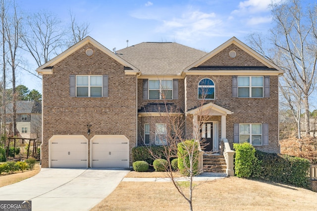 view of front of house with concrete driveway, an attached garage, and brick siding