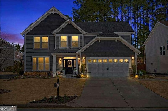 view of front facade featuring driveway and an attached garage