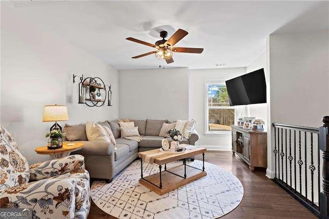 living area featuring ceiling fan and wood finished floors