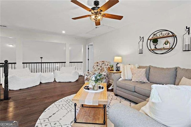 living room with wood finished floors and a ceiling fan