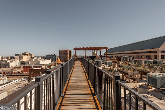 surrounding community featuring a view of city and a pergola