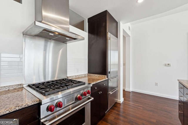 3325 Piedmont Rd NE Unit 1504, Atlanta, GA 30305 - kitchen with dark brown cabinetry, dark wood-type flooring, high end range, decorative backsplash, and wall chimney exhaust hood