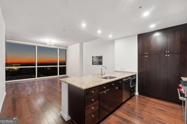 3325 Piedmont Rd NE Unit 1504, Atlanta, GA 30305 - kitchen featuring a peninsula, dishwasher, dark wood finished floors, and a sink