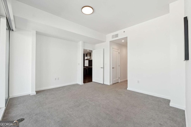 3325 Piedmont Rd NE Unit 1504, Atlanta, GA 30305 - unfurnished room with carpet flooring, visible vents, and baseboards