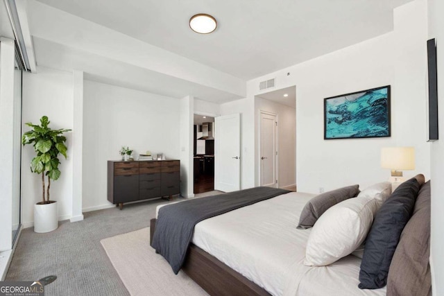 3325 Piedmont Rd NE Unit 1504, Atlanta, GA 30305 - bedroom featuring baseboards, visible vents, and light colored carpet