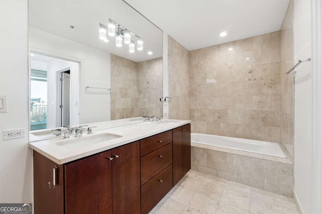 3325 Piedmont Rd NE Unit 1504, Atlanta, GA 30305 - bathroom featuring a relaxing tiled tub, tile patterned floors, a sink, and double vanity