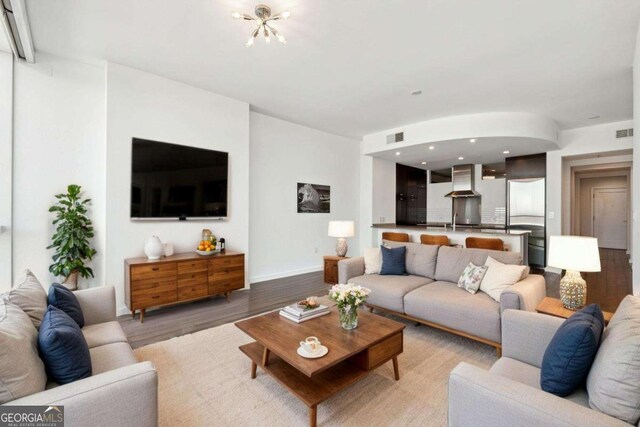 3325 Piedmont Rd NE Unit 1504, Atlanta, GA 30305 - living area featuring recessed lighting, light wood-type flooring, visible vents, and baseboards