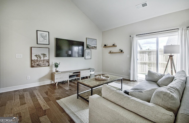 living room featuring high vaulted ceiling, wood finished floors, visible vents, and baseboards