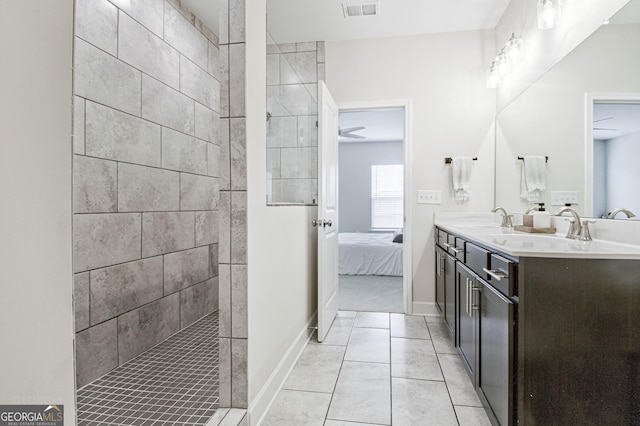 full bathroom featuring a walk in shower, visible vents, a sink, and ensuite bathroom