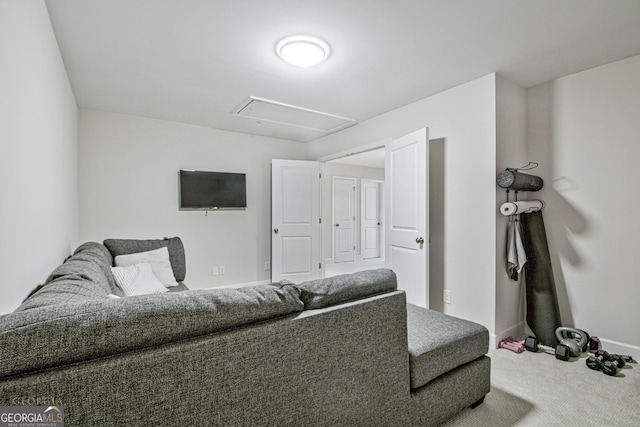 living area featuring carpet and baseboards