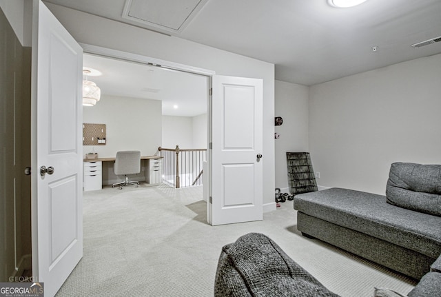 sitting room featuring visible vents and carpet flooring