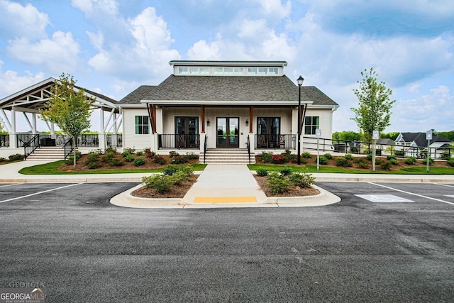 view of property with uncovered parking