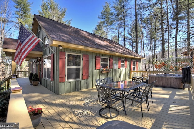 wooden deck with outdoor dining area