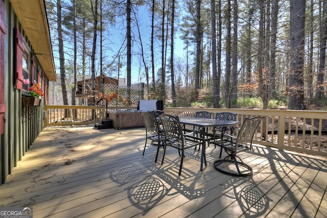 deck with outdoor dining area