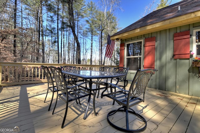 wooden deck with outdoor dining area