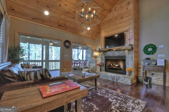 living area featuring a notable chandelier, a stone fireplace, high vaulted ceiling, wooden ceiling, and hardwood / wood-style floors